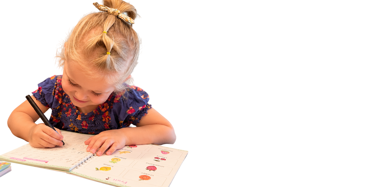 A girl writing in a copybook