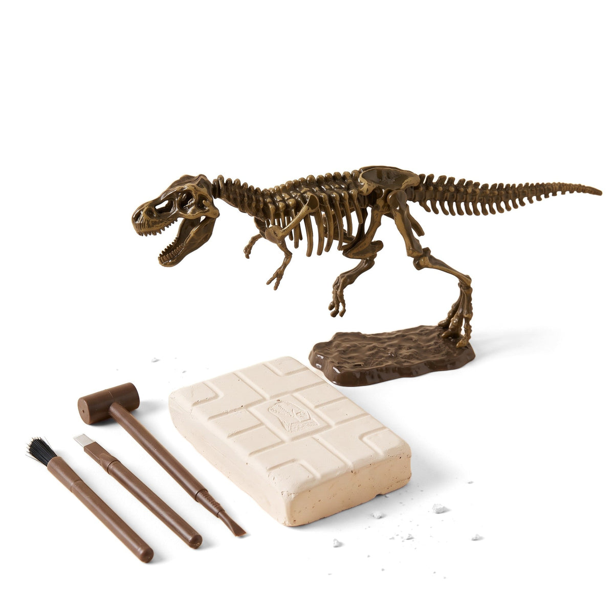 Dinosaur Excavation Kit: a T. rex skeleton model on a stand, a plaster dig block, a mallet, a chisel and a brush