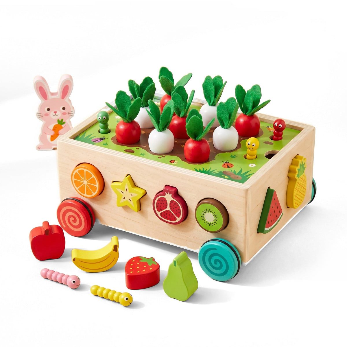Garden Shape Sorter: a wooden cart with red and white radishes planted on top, fruit blocks in its sides and a rabbit figure