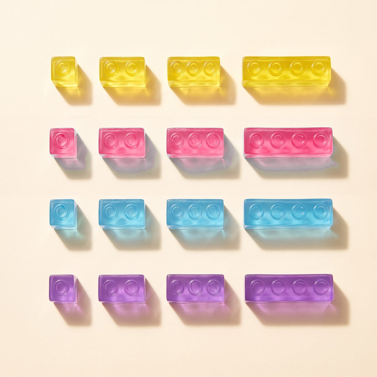 Block sizes and colours: yellow, pink, blue and purple blocks, each in four lengths from 1 stud to 4 studs