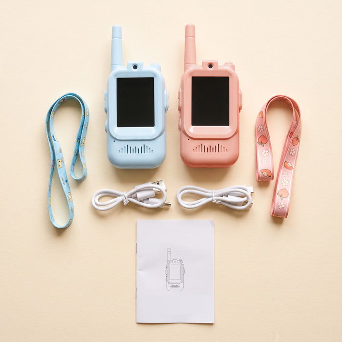 What's in the box: a pale blue and a peach walkie-talkie, 2 patterned lanyards, 2 white USB cables and an instruction booklet