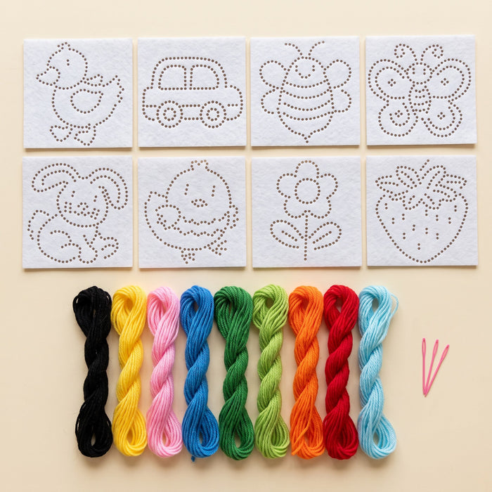 In the kit: eight felt cards (duck, car, bee, butterfly, bunny, chick, flower, strawberry), nine thread bundles, two needles